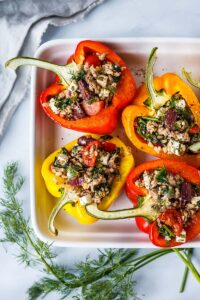 Mediterranean Stuffed Peppers in a baking dish.