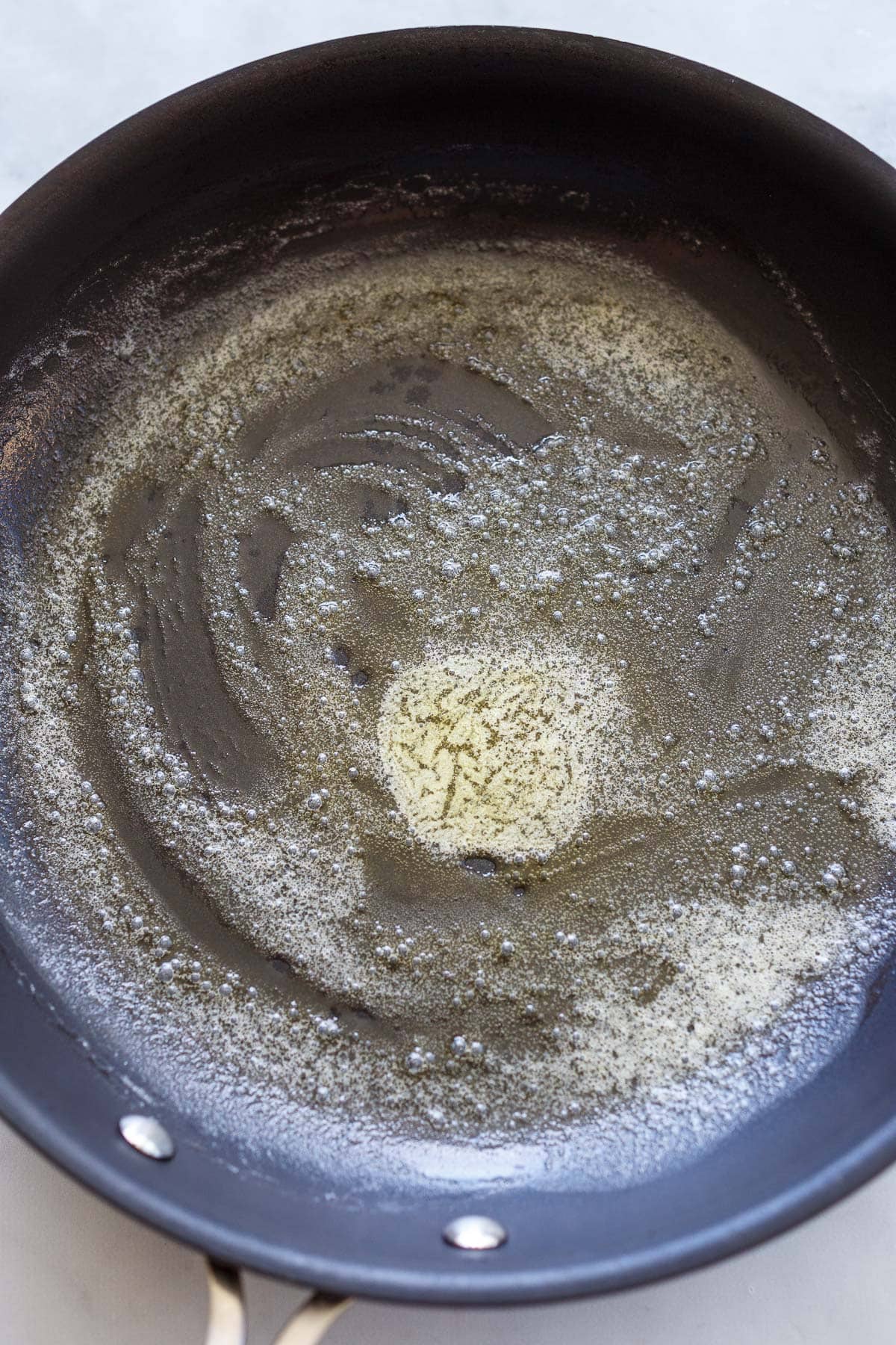 butter melted and spread out in skillet.