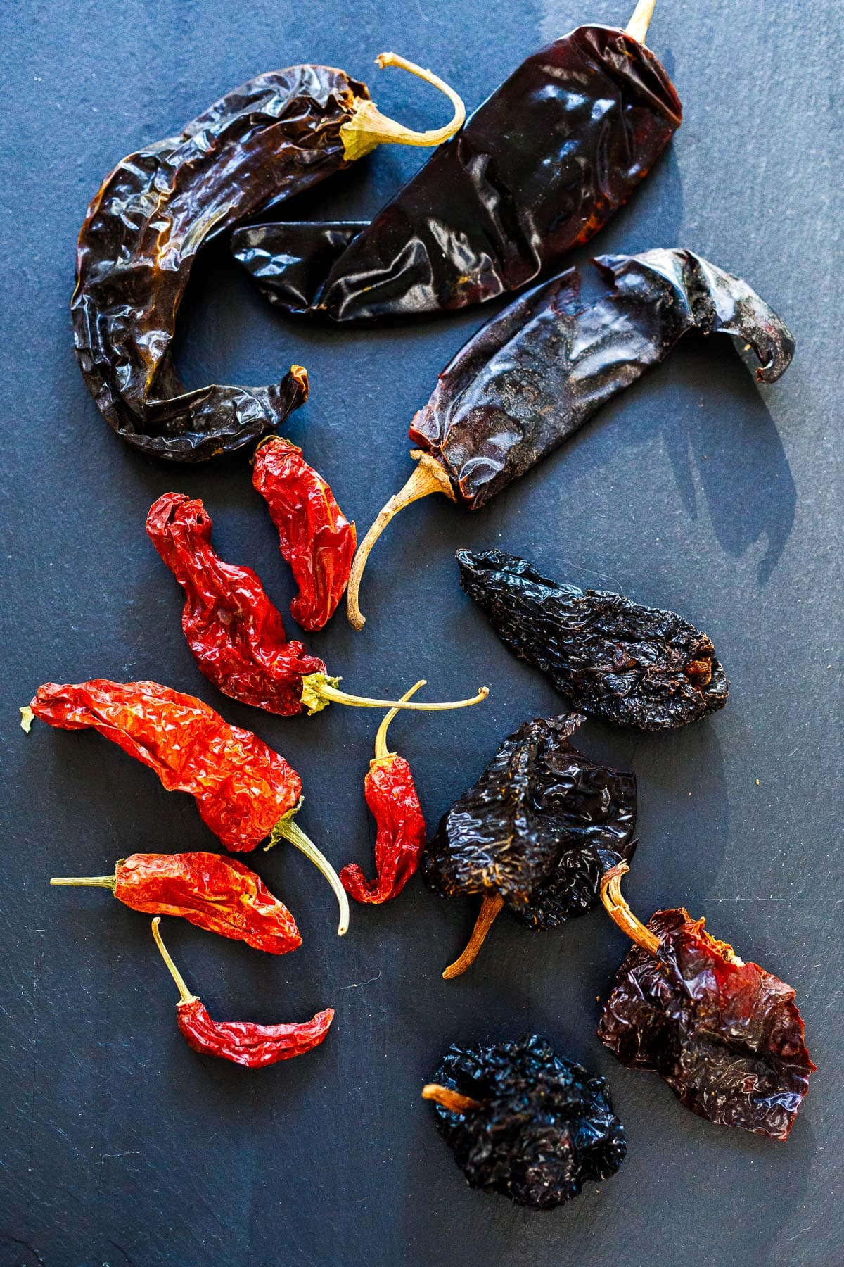 assorted dried chilies laid out.