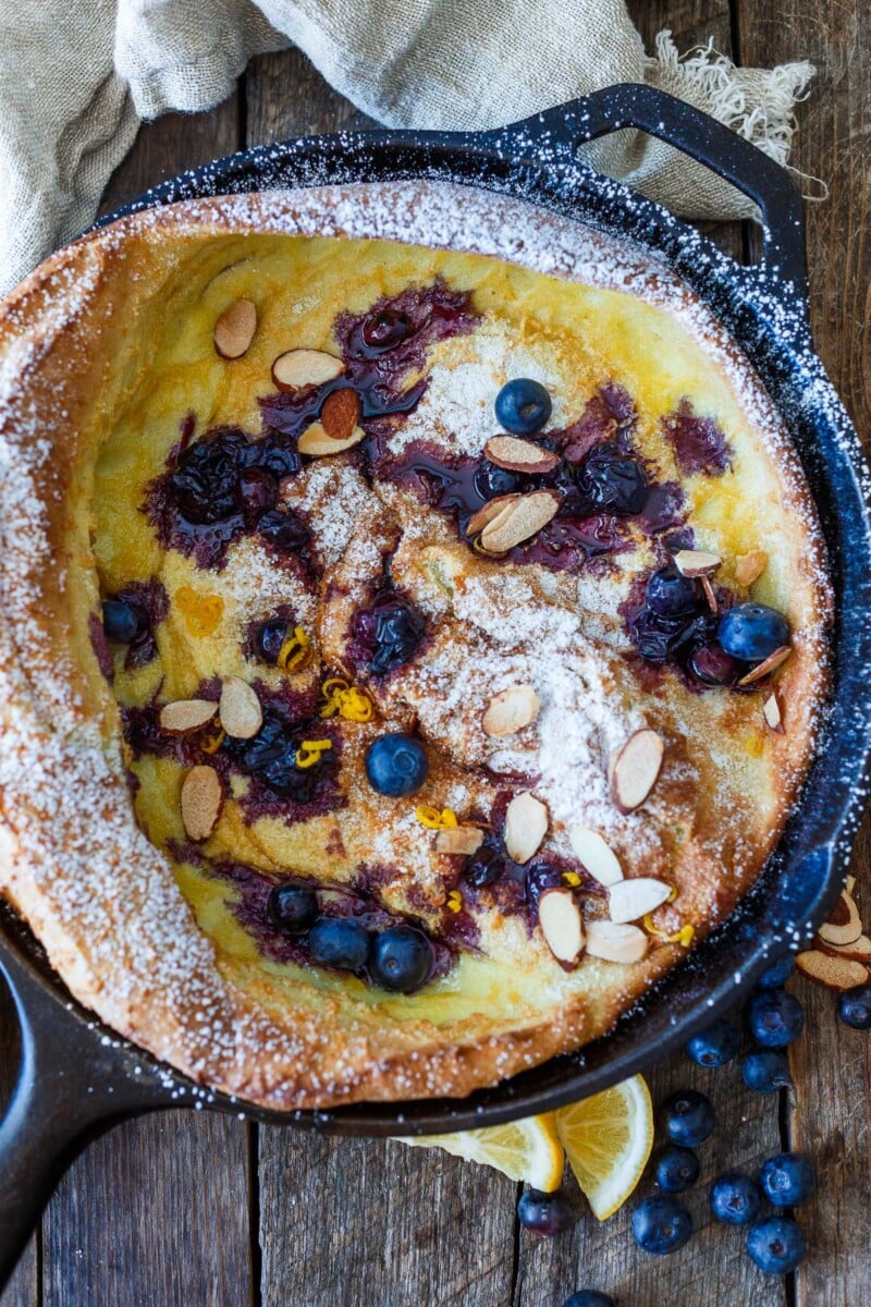 Delicious and impressive Blueberry Dutch Baby is made with everyday pantry ingredients and requires only about 10 minutes of hands-on time! Top with maple-sweetened blueberry sauce for a perfect brunch or dessert.